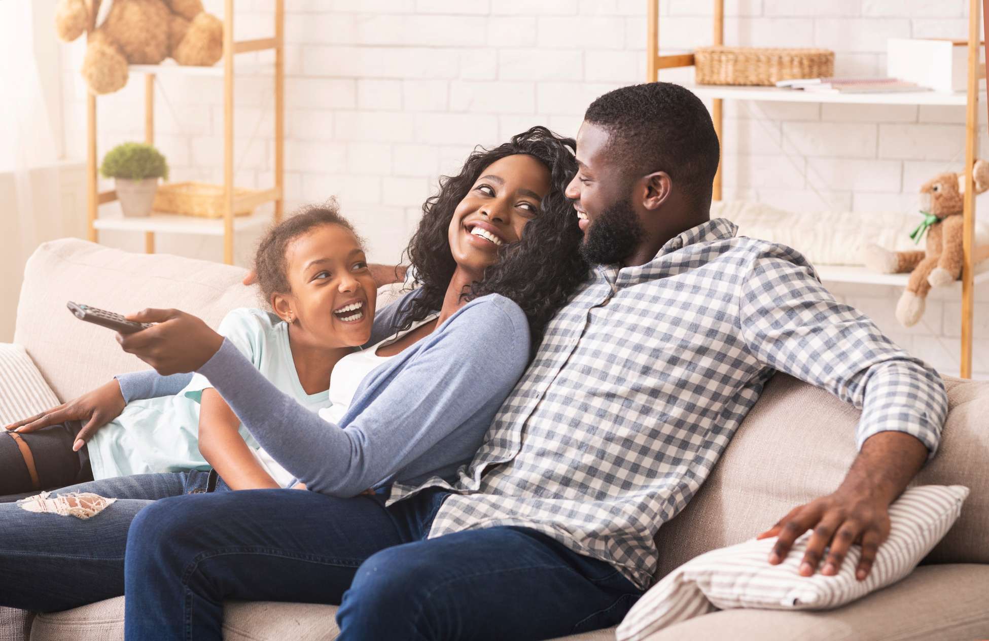 family enjoying eachothers company on couch