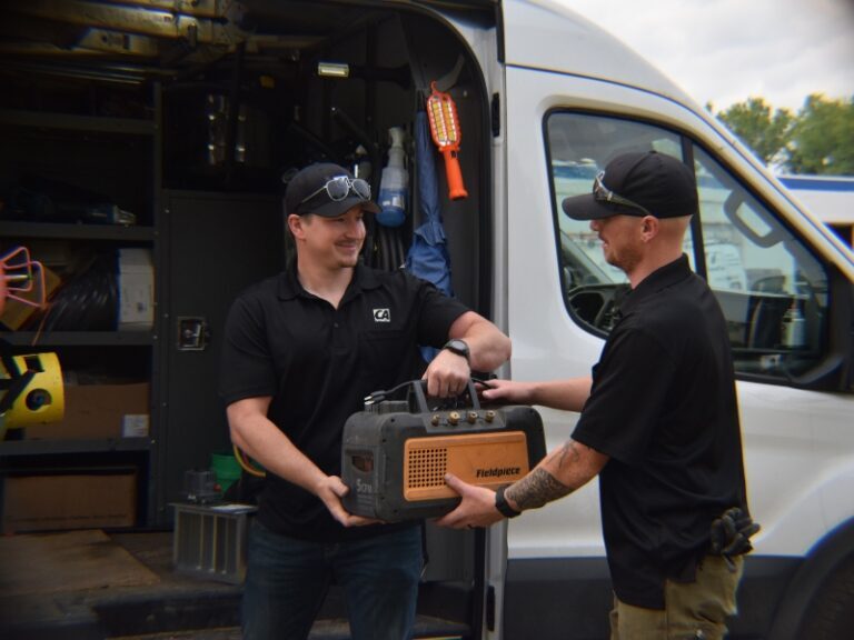 Custom Air service technicians working on a project.
